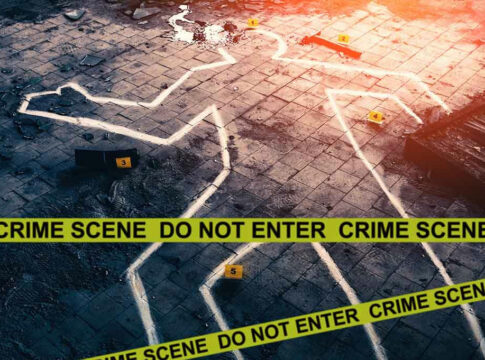 Crime scene with chalk outline and evidence markers.