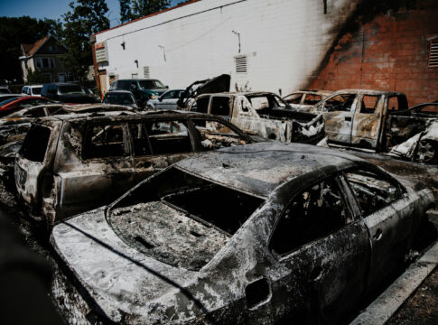 Burned cars in a parking lot after a fire